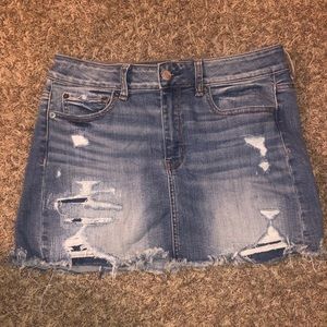 Destroyed blue denim skirt